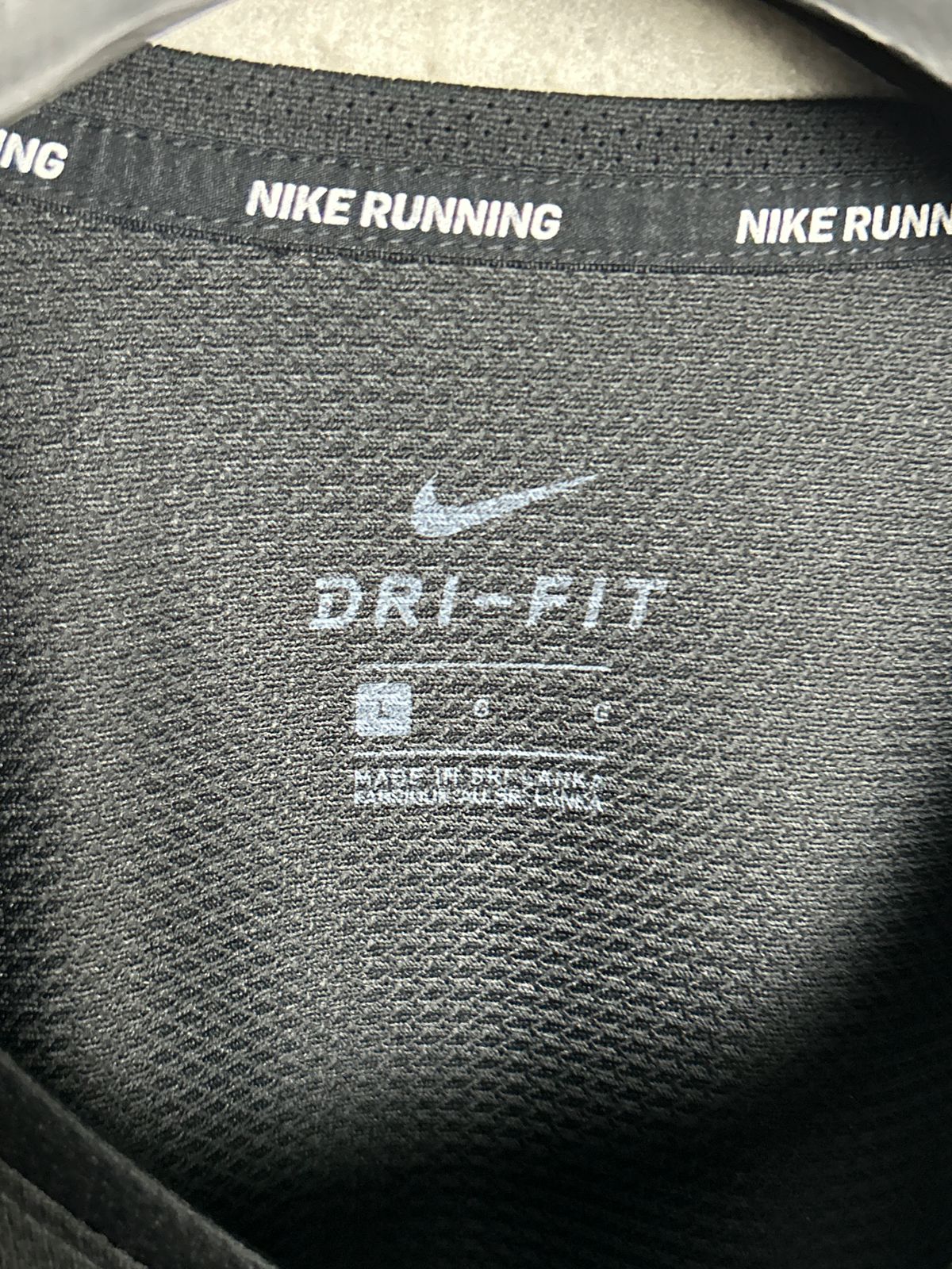 Nike Dri Fit Big Logo We Run Wild Round Neck - Large